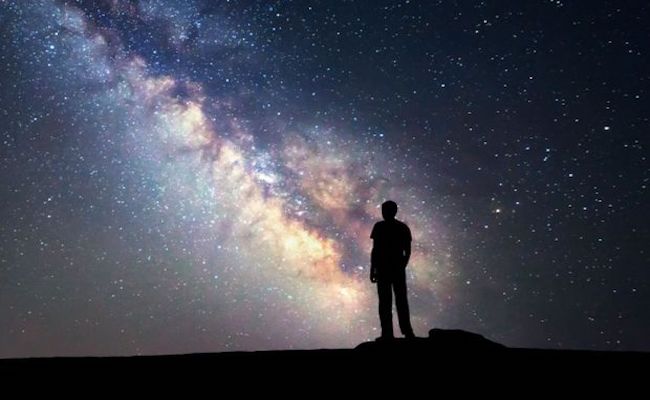 person-looking-at-starry-night-sky